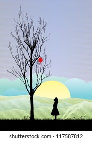 A girl looking at balloon in a tree