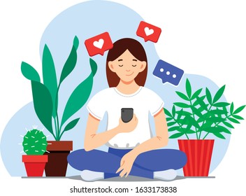 girl looking at a smartphone surrounded by flowers