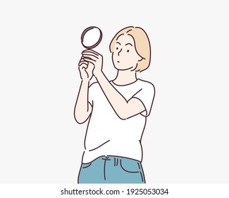 girl looking through a magnifying glass. Hand drawn style vector design illustrations.