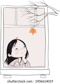 A girl looks through the window at the last autumn leaf on a tree 