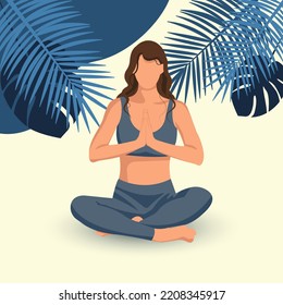 A girl in a lotus position practices yoga against the background of blue tropical leaves. Yoga concept for poster, banner, website
