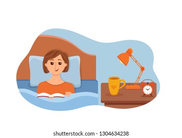 Girl lying on bed in home bedroom and reading a book in her hands under lamp light. Vector illustration of young woman having rest, relax, cozy comfortable night home interior with cup of tea, clock. 