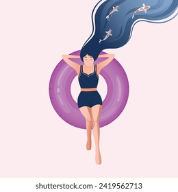 Girl lying on a pink swim lap. A girl with dark blue hair and in a dark blue swimsuit rests on a swimming lap. Japanese koi carp swim above her.