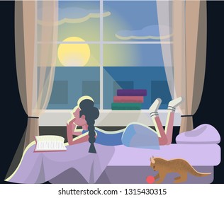 girl lying on the window with her playing  cat and books and looking on the sun