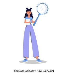Girl with a magnifying glass in her hands