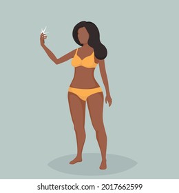 A girl makes selfie using a mobile phone.