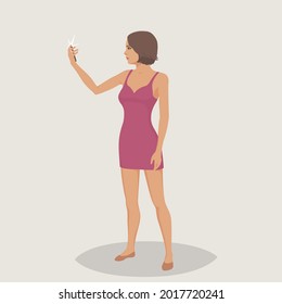 A girl makes selfie using a mobile phone.
