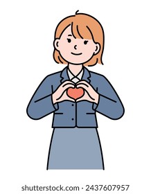 The girl is making a heart with her hands.