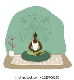 A girl meditates on the cushion. With mandala pattern on the background wall.Vector flat illustration.Cartoon style.