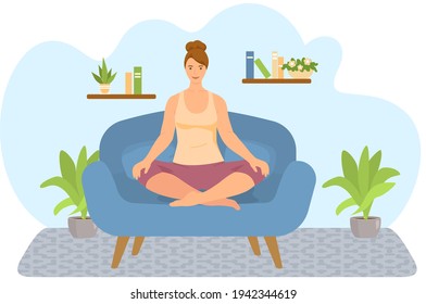 Girl meditates on sofa in living room. Woman doing yoga at home. Healthy lifestyle concept