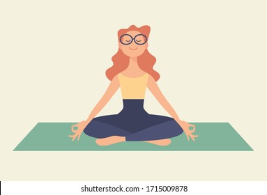 Girl meditates on a yoga mat