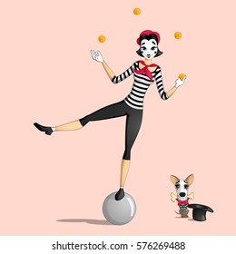 A girl mime performing a pantomime called juggling with oranges standing on a ball and a dog with a bone in its mouth