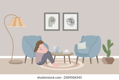 A girl in a psychologist’s office sits on the floor and holds her head with her hands. A psychologist's office, a cozy room with two armchairs, a floor lamp, paintings, paper napkins and a cactus. 