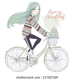 girl on a bicycle with a Christmas tree