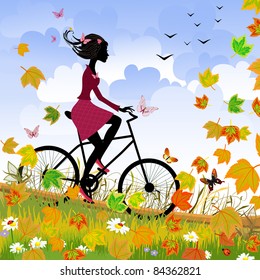 Girl on bike outdoors in autumn