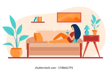Girl on the couch is drinking coffee or tea.
