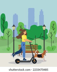 Girl on an electric scooter for a walk in the park with a beagle dog. Modern ecological transport. Modern lifestyle, technology. Eco transport for urban lifestyle. Can be rented for a fast ride.