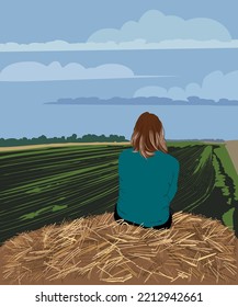 Girl on a haystack in a field