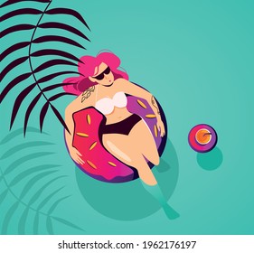 A girl on an inflatable ring in the form of a donut is resting in a tropical paradise, next to a tropical cocktail on an inflatable ring. Vacation concept, summer.