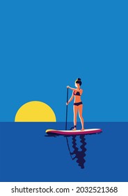 girl on paddleboarding in the sea at sunset