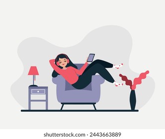 Girl on the sofa listening to music on headphones.