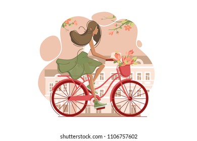 Girl on vintage bicycle with flowers