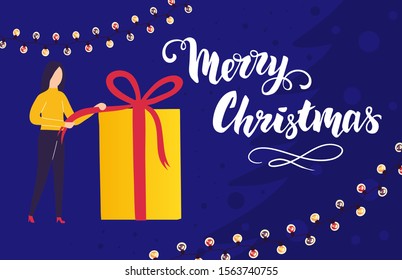 The girl opens a gift. Pulling a ribbon to untie a bow on a gift box