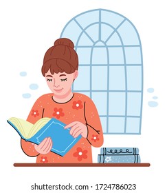 A girl in an orange sweater reads a book. The girl in the library. The schoolgirl is studying. Smiling student searching, studying. Higher education. Business, and college concept.