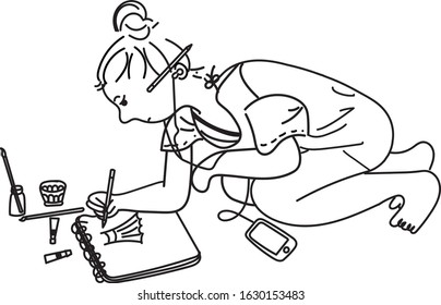 a girl is painting while sitting on the floor