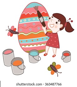Girl paints Easter egg
