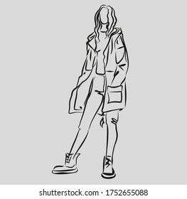 girl in a parka jacket in autumn in boots