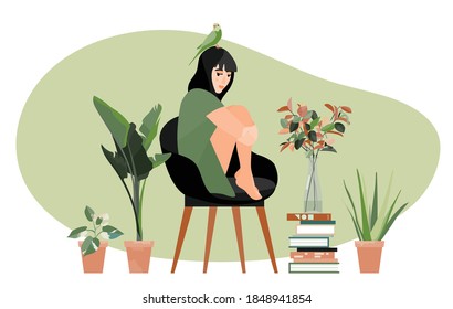 A girl with a parrot on her head sits in a chair. Houseplants. A stack of books. Green gamut. Home garden. Stay home. Vector illustration. Black haired girl in green dress. Plants in a glass bottle.