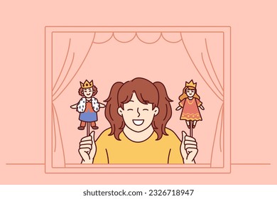 Girl performs in puppet theater showing scene with prince and princess for concept of children creativity. Little schoolgirl smiles after participating in theater production for classmates