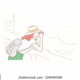 Girl photographing the mountains. Hand drawn style vector design illustrations.