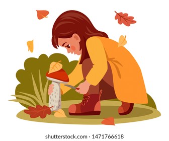 girl picking mushrooms, sat down to cut it with a knife