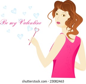 Girl is pink clothes using a pink blower in heart shape for hearts soap bubbles. With sign "Be my Valentine"