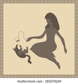 Girl playing by bow with cat