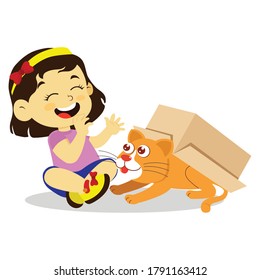 girl playing with cat in cardboard