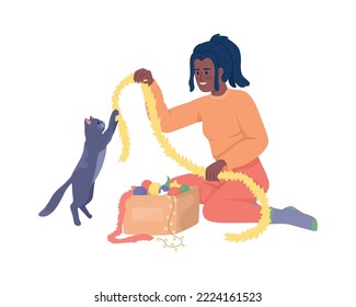 Girl playing with cat using Christmas ornament semi flat color vector character. Editable figure. Full body person on white. Simple cartoon style illustration for web graphic design and animation