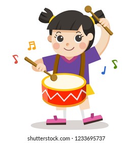 A Girl playing drum on white background. Child musical performance.