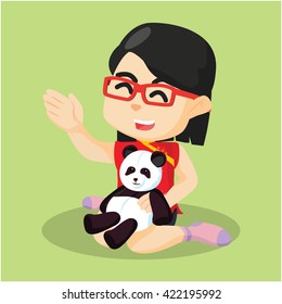girl playing with her panda doll