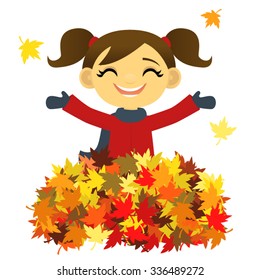 Girl playing in a pile of autumn leaves