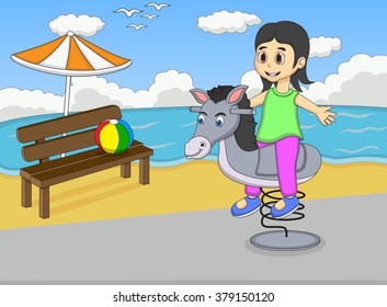 Girl playing rocking horse at the beach