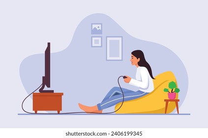 Girl playing video games while sitting on an ottoman at home