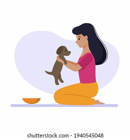 A girl plays with a cute puppy. A woman and a pet. Vector character in a flat style.