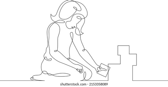 The girl plays. One continuous line.Kids games. A small child plays with blocks. Educational games for children. Toddler games.One continuous line drawn isolated, white background.