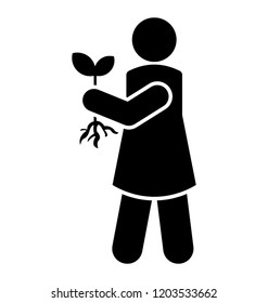 Girl plucking plant from garden 