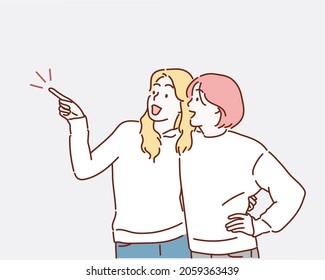 Girl Pointing Finger Showing Her Friends Something Standing Over White Background. Hand drawn style vector design illustrations.