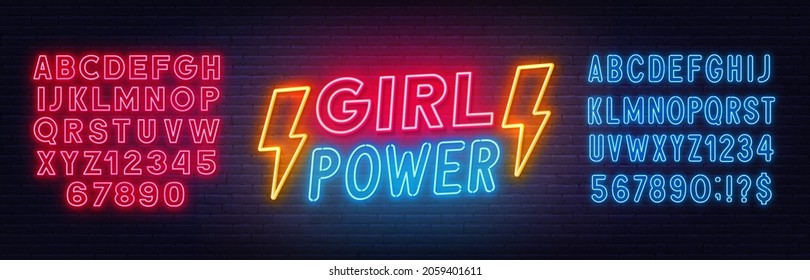 Girl Power neon lettering on brick wall background.