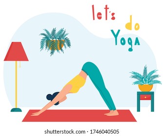 The girl practices yoga at home.The concept of yoga classes at home. A woman in the dog pose with her face down. Practice yoga in the living room. Female character on the background of home furniture